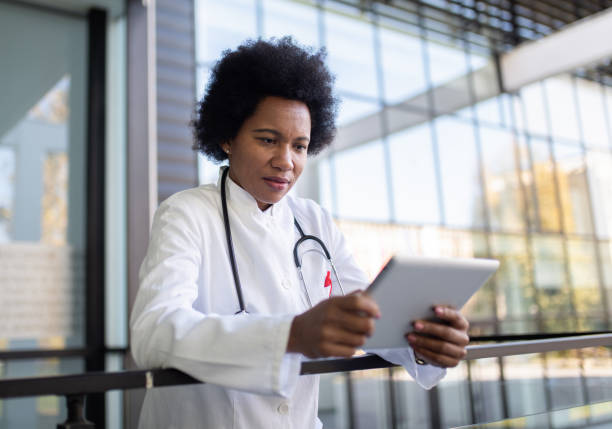 istock Female doctor working on digital tablet. 1293673040