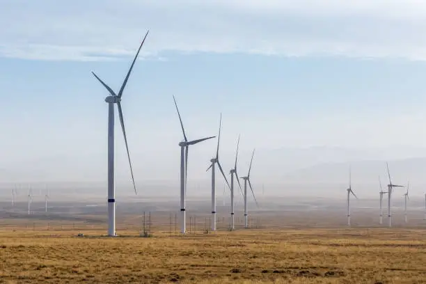 group of wind turbines on wilderness, wind power plant closeup