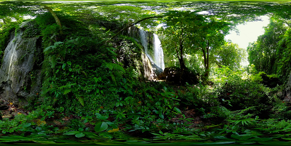 Beautiful waterfall in green forest. Tropical Kawasan Falls in mountain jungle. Bohol, Philippines. Waterfall in the tropical forest. 360 panorama VR.