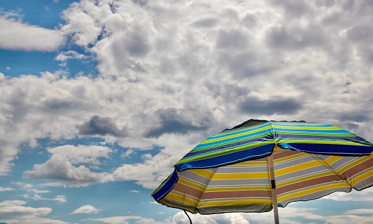 Four sun loungers by the sea at miami beach, florida