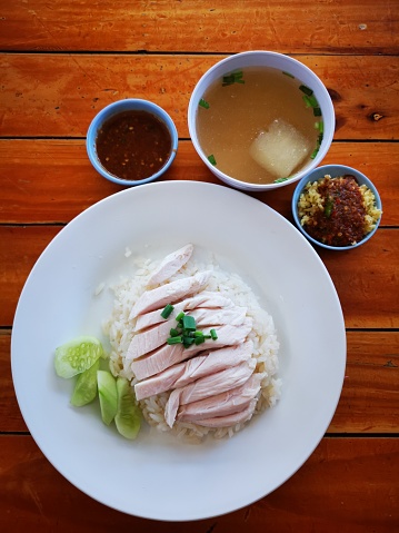 Close-up Boiled chicken rice on the wooden table