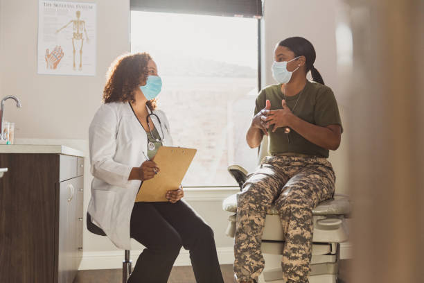 istock Soldier gestures while explaining symptoms to female doctor 1293681761