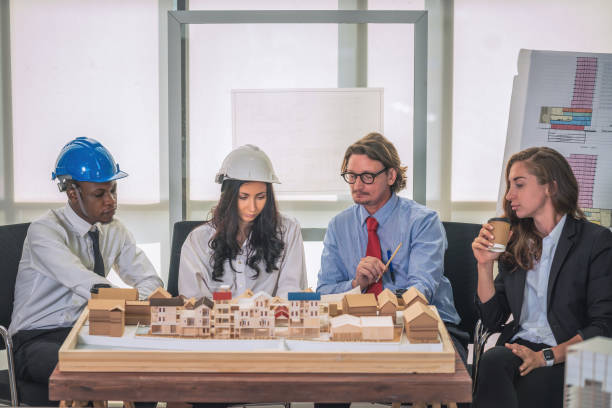 istock architecture business background of diverse project development architect team have brainstorming for residential project work with project architecture model on table in architecture office 1293681778