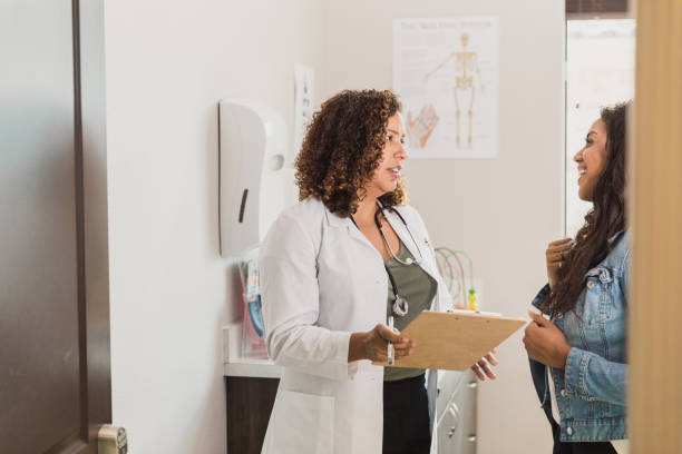istock Healthcare professional talks with patient 1293681790