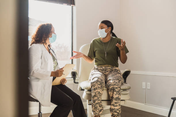 istock Female veteran talks with doctor 1293681831