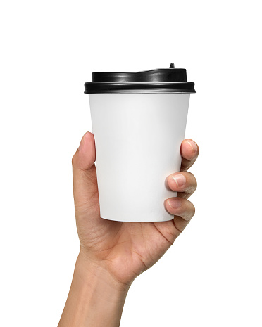 Male hand holding blank paper coffee cup isolated on white background