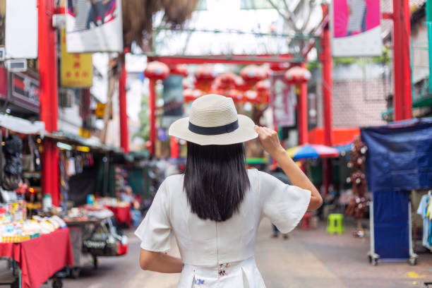 istock Young solo traveler in Kuala Lumpur Chinatown district 1293683721