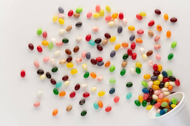 istock Jelly beans spilling from white foam cup 1293684247