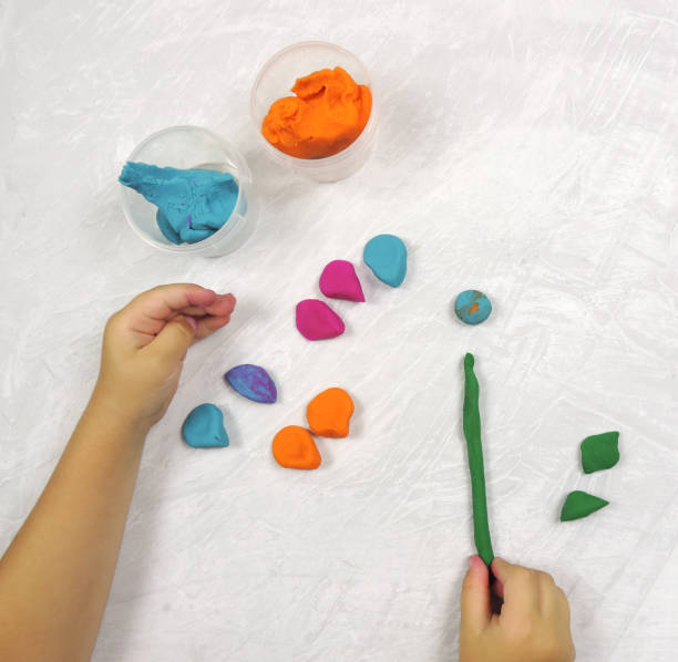 istock multi-colored plasticine for children's creativity and crafts, elements for making a flower, petals and a stem 1293684383