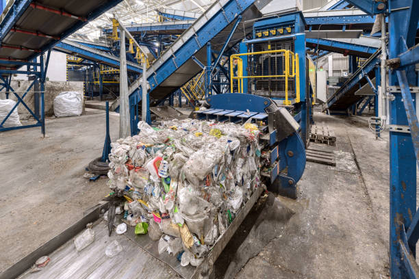 istock Household waste sorting and recycling plant. Press for pressing plastic bottles 1293686498