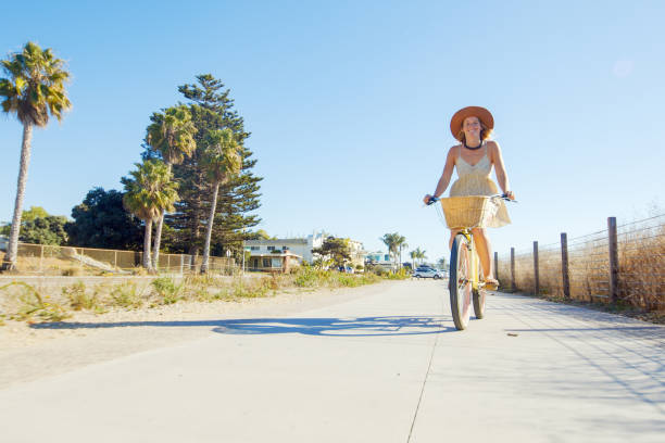 istock Woman Riding Bike 1293687279