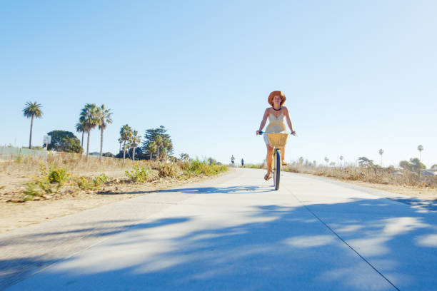 istock Woman Riding Bike 1293687281