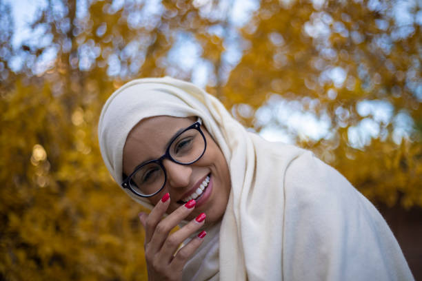 A portrait of a woman with a hijab on.
