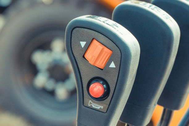 istock Operating control panels or levers with buttons in forklift or other industrial machine 1293695382