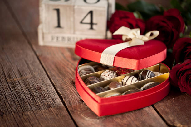 istock Valentine's Day Box of Chocolates and Red Roses 1293698149