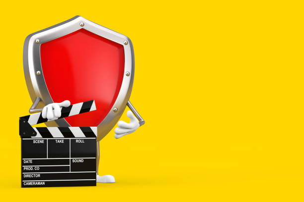 istock Red Metal Protection Shield Character Mascot with Movie Clapper Board. 3d Rendering 1293700008