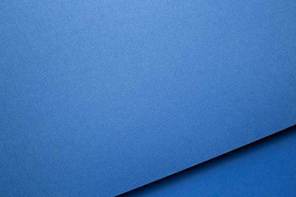 istock Abstract blue layered color paper background 1293702761