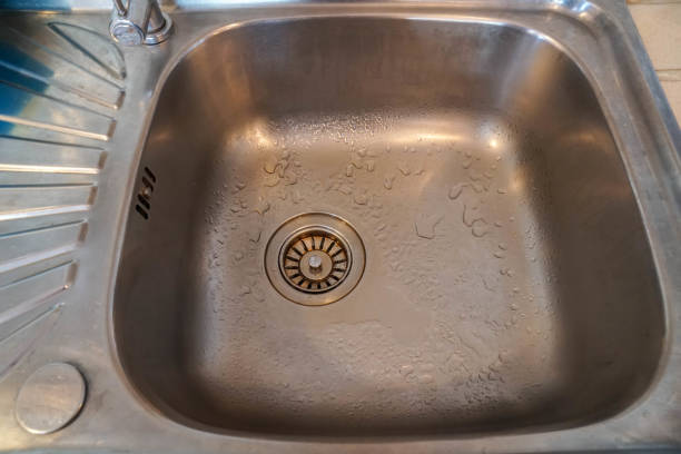 istock close up clean stainless wash basin in kitchen at home 1293704168