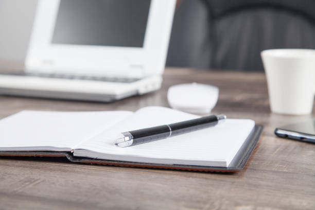istock Pen and notepad on the desk. Business workplace 1293705810
