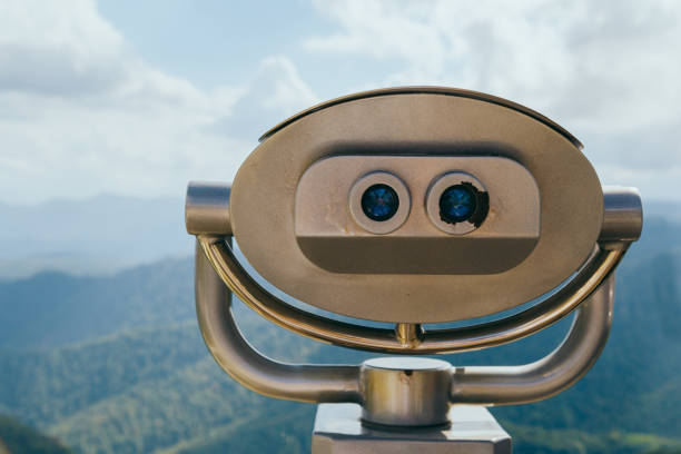 istock Binoculars with coins overlooking the Blue Mountains, Landscape with beautiful cloudy sky and mountains .. 1293710104