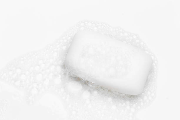 istock Soap bar and foam on white background, top view. Mockup for design 1293710195