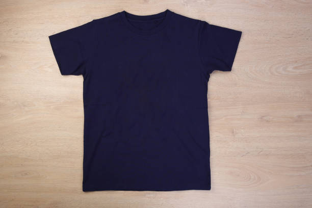 istock Front navy blue tshirt on wooden background 1293712717