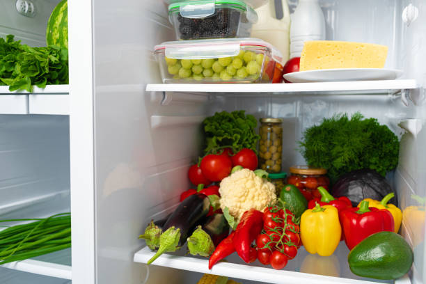 istock Fridge shelf full of fresh vegetables close up 1293713314