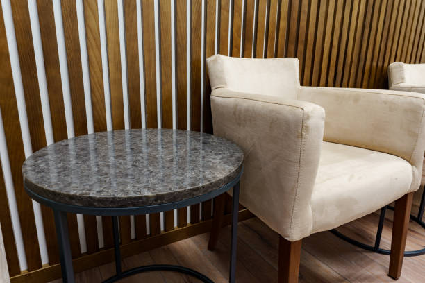 istock Office waiting area with arm chairs and coffee table 1293715544
