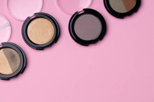 istock Set of eyeshadows make up products on pink 1293719283