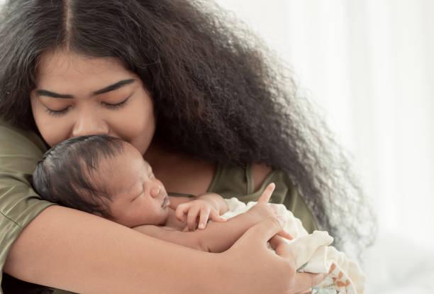 istock African mom kissing her baby 1293719968