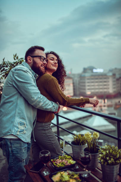 Female Enjoying Date With Boyfriend And Good Conversation With Food And Wine Female Enjoying Date With Boyfriend And Good Conversation With Food And Wine caesar salad food salad tuna stock pictures, royalty-free photos & images