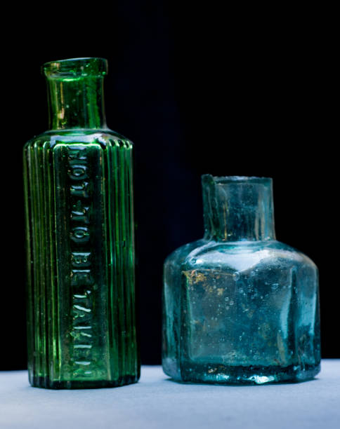 istock Two old medicne  or poison bottles. not to be taken. 1293720775