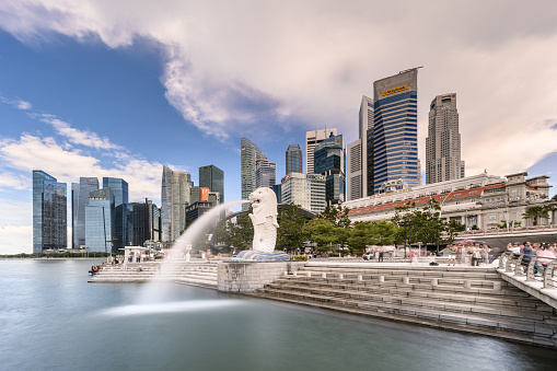 Marina Bay Sands, Singapore - May 28, 2023: Ferris Wheel and Cityscape with Blue Sky