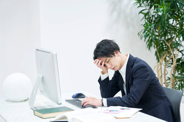 Asian office worker working at the office Asian office worker working at the office only japanese stock pictures, royalty-free photos & images