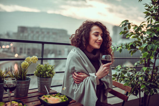 istock Rooftop Dinner With Fine Wine For Smiling Female 1293722879