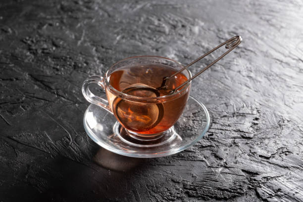 istock Hot Herbal Tea on the Black Background 1293723954