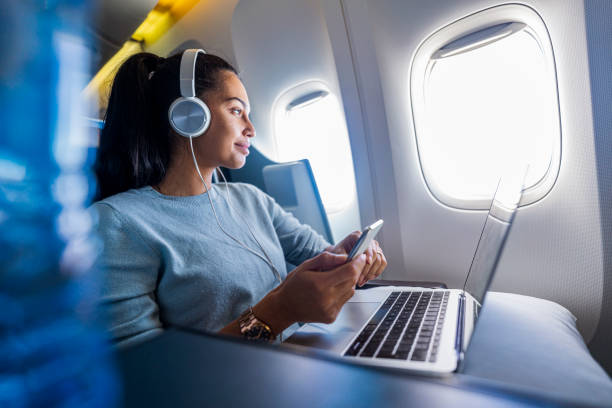 Young female freelancer enjoys her flight