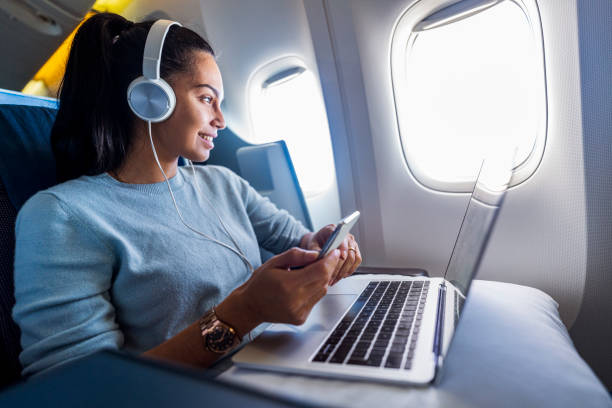 istock Young female freelancer enjoys her flight 1293725468