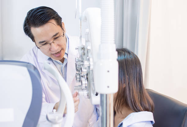 istock Ophthalmologist doing eyes test  for a woman 1293726338