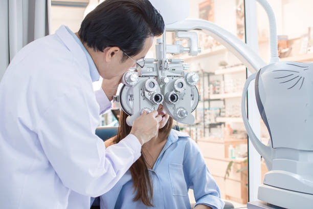 istock woman doing eyes test in optical lab. 1293726513