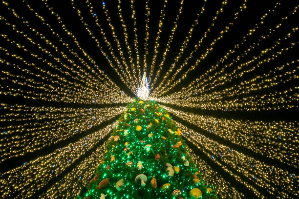 istock Christmas tree covered with garlands ribbons 1293733148
