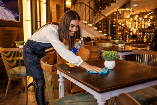 istock Waitress cleaning up at a restaurant. 1293735290