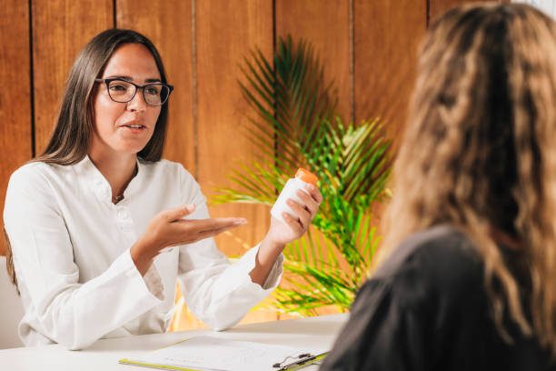 istock Dietitian Recommending Dietary Supplements to a Female Client 1293735443