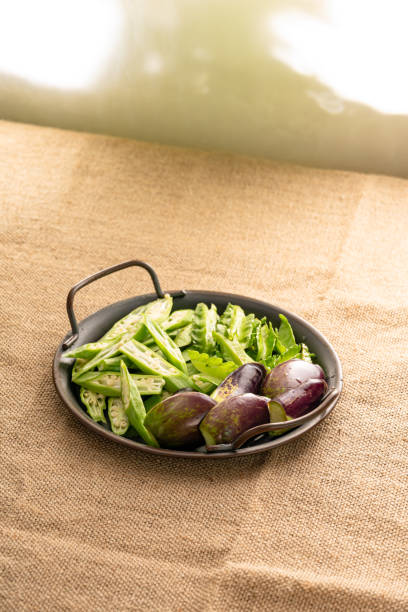 green vegetable ingredients lime garlic onion on vintage sunny day light background setup - lime market vietnam fruit imagens e fotografias de stock