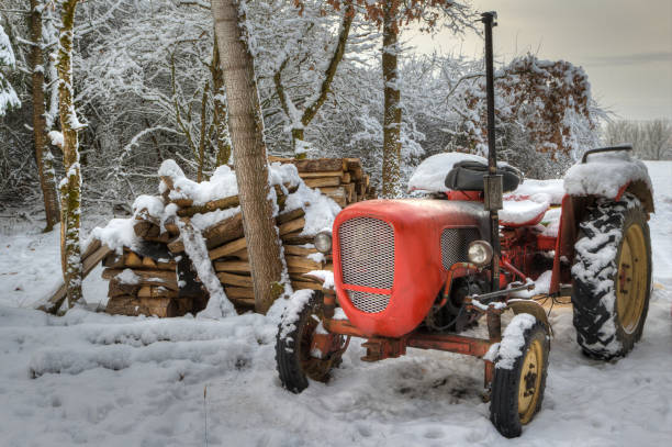 istock Red tractor in a white winter landscape. 1293740249