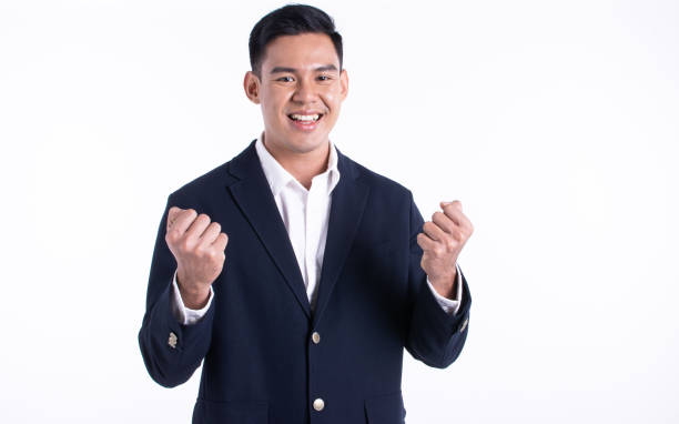istock Asian business man doing gesture of success 1293742020