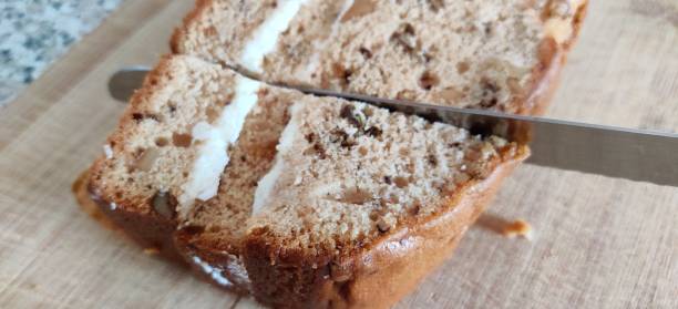 istock High angle of knife cutting through walnut cake 1293742202