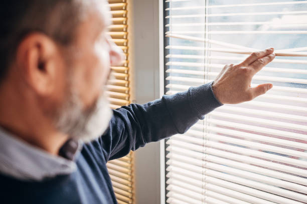 istock An older businessman looks out the window 1293742280