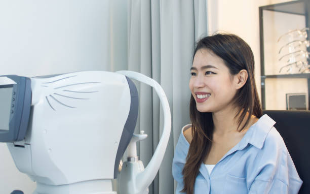 istock woman doing eyes test in optical lab. 1293743439