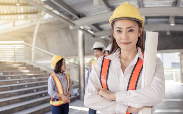 istock Portrait of female engineer standing in construction site 1293745594